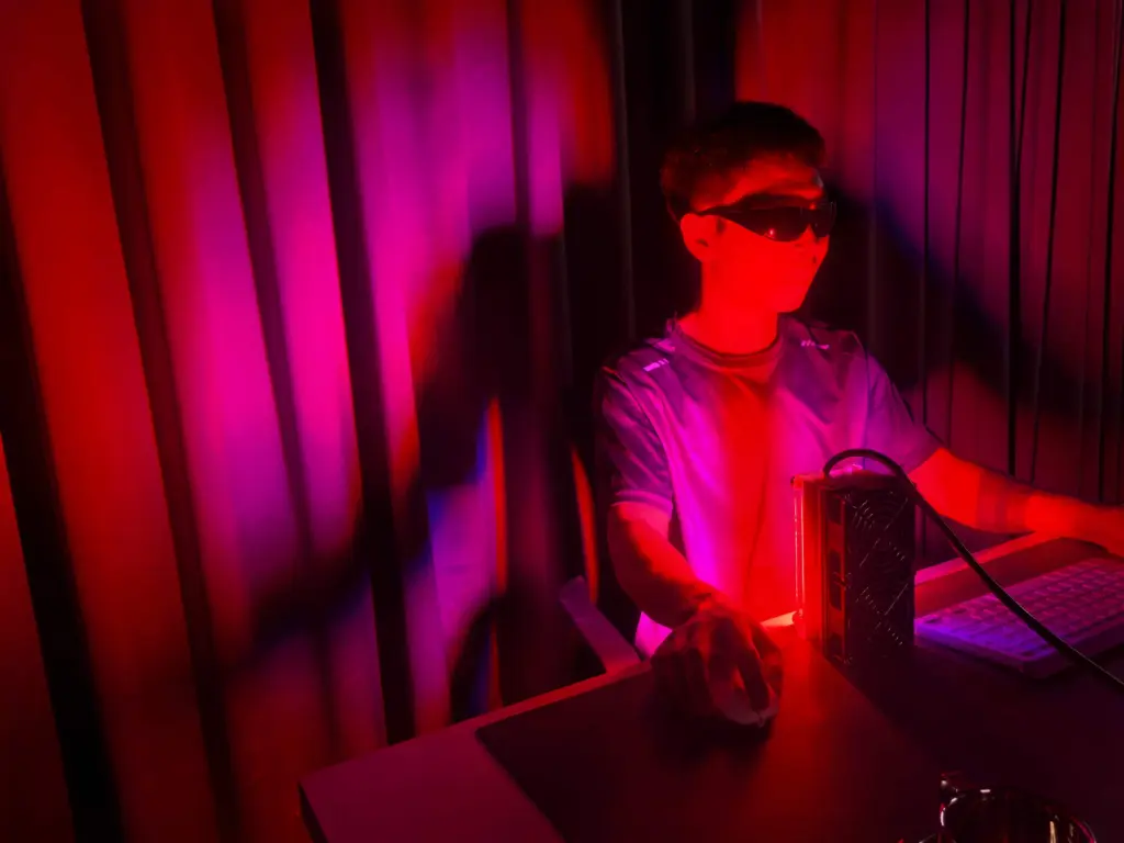 Sweet Aurora-D soft pink-red ambient lighting for midday desk relaxation, accented with eyewear to fit the calming retreat vibe