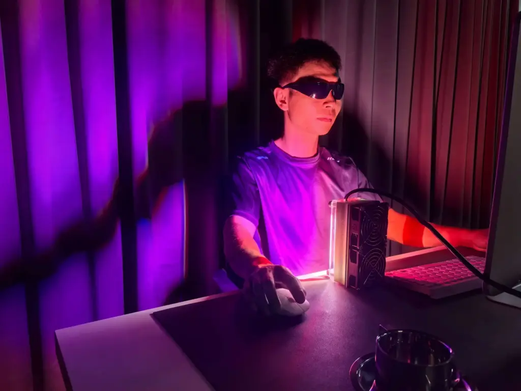 A person interacting with a light source: Use the Sunlight-Like Glow Alarm Lamp as part of your daily routine—this gentle light source offers a soft illumination option for regular daily moments.